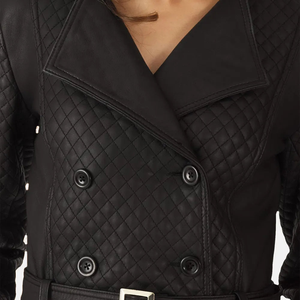 A stylish woman wearing a black leather trench coat and boots, looking confident and ready for any occasion.