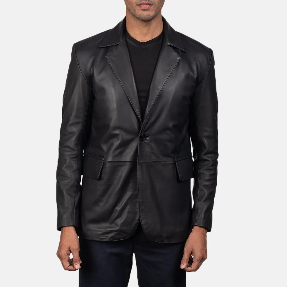 An edgy man rocking a black blazer jacket men's, adding a touch of rebellion to his look.