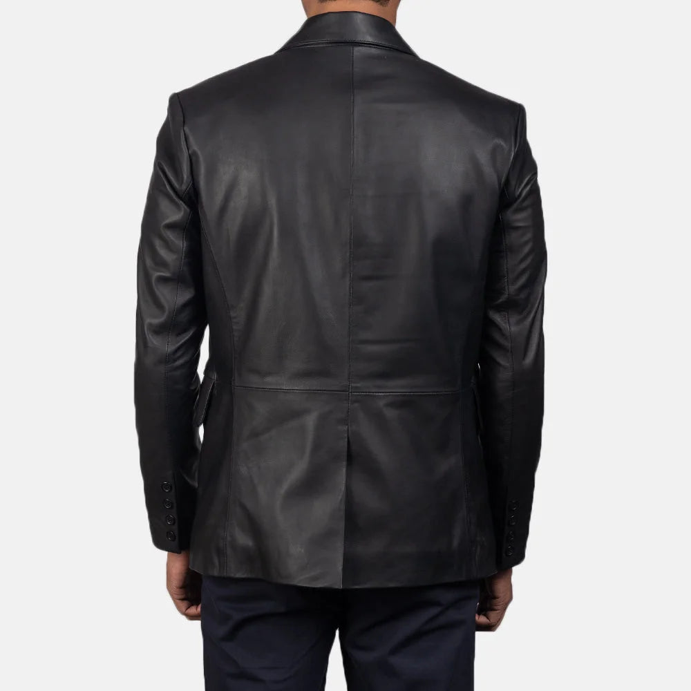 An edgy man rocking a black blazer jacket men's, adding a touch of rebellion to his look.