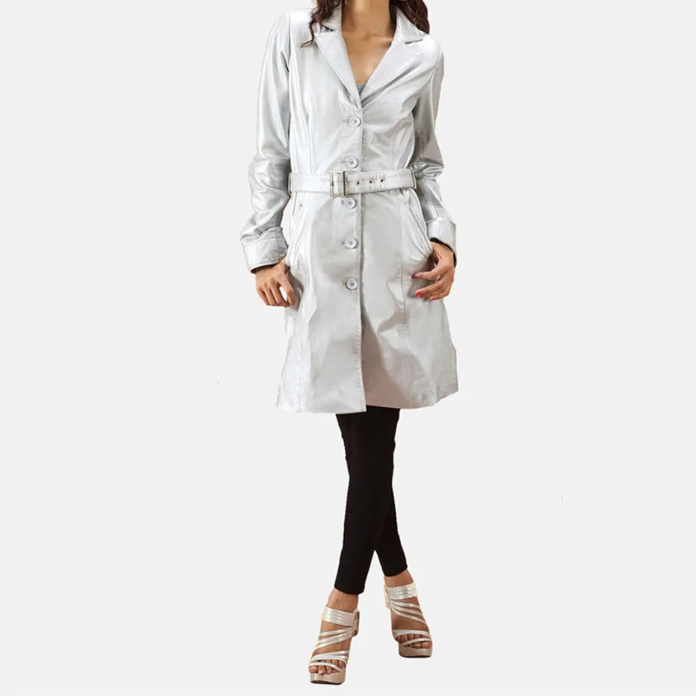 Woman in silver leather trench coat and black pants