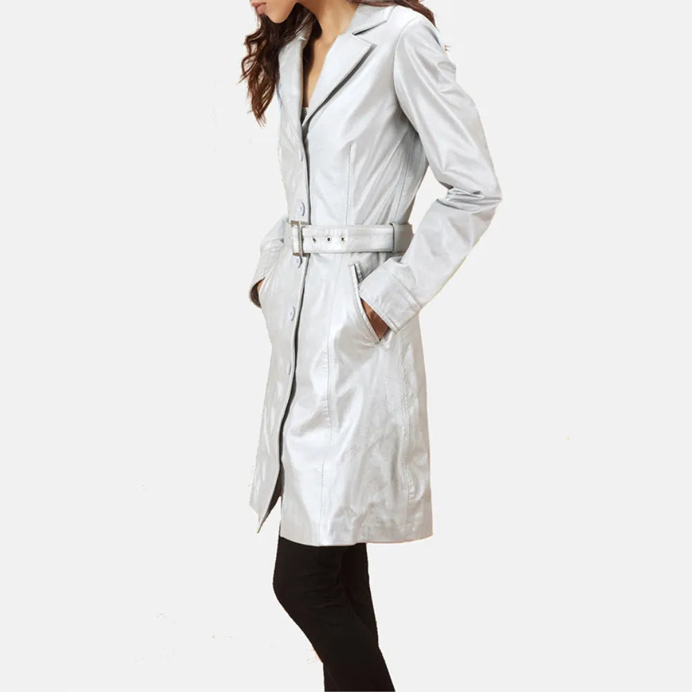 Woman in silver leather trench coat and black pants