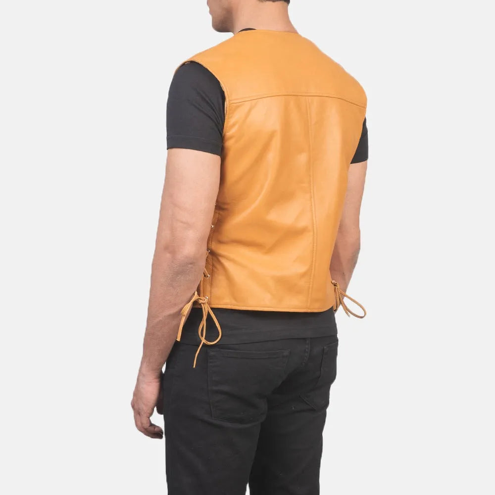 A leather vest, adds a touch of style to outfit with a trendy tan colour leather jacket.