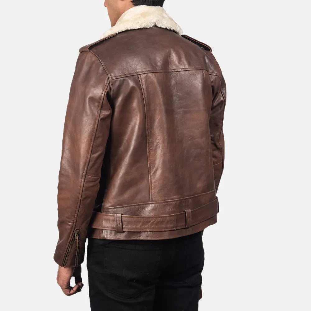 A stylish brown leather motorcycle jacket with a cozy shearling collar, perfect for adding a touch of rugged sophistication to any outfit.