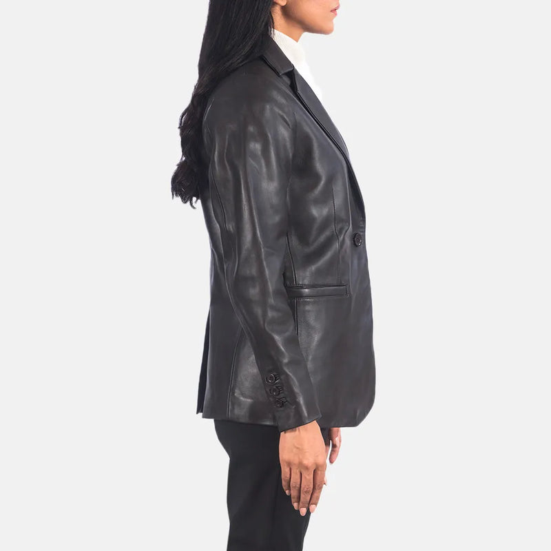 A stylish woman rocking a black leather blazer, exuding confidence and elegance in her fashionable outfit.