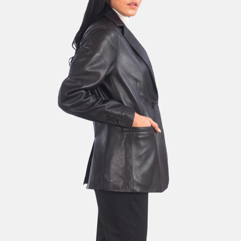 A stylish woman rocking a black leather blazer, exuding confidence and elegance in her fashionable outfit.