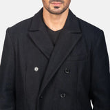 A fashionable man donning a black pea coat, exuding elegance and sophistication in his Black long leather coat.