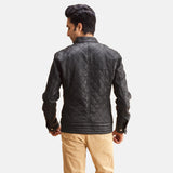 A fashionable man wearing a black zipper jacket. Ideal for a casual and laid-back vibe.