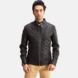 A fashionable man wearing a black zipper jacket. Ideal for a casual and laid-back vibe.