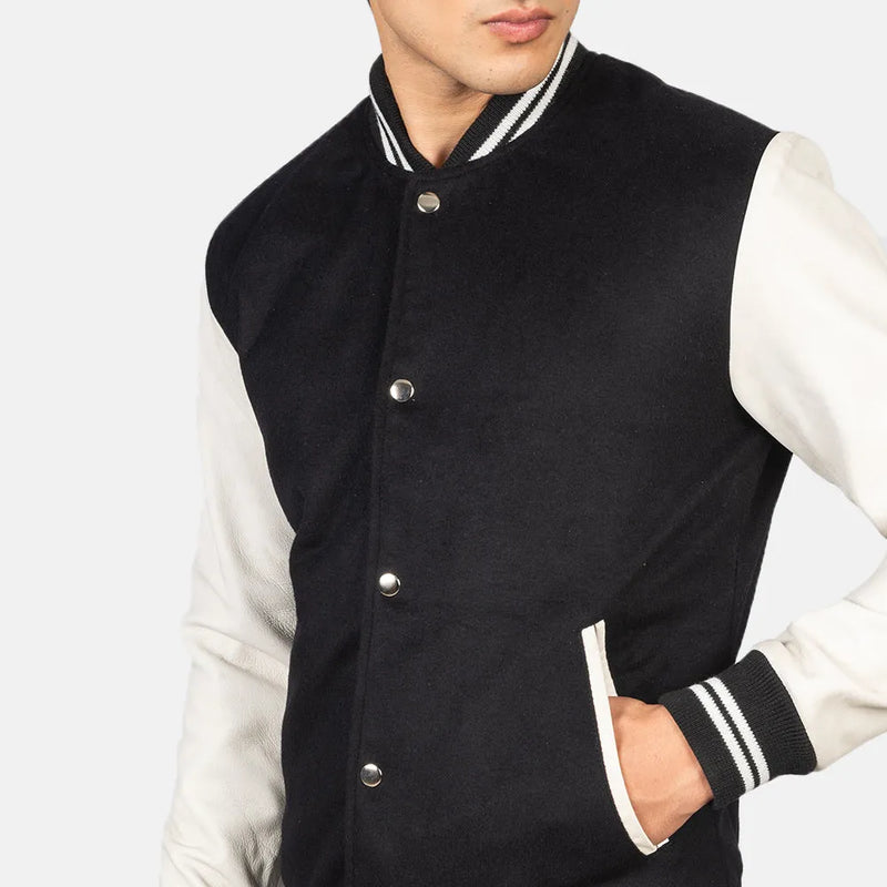 This black and white varsity jacket, crafted from a combination of cotton and wool, offers a fashionable outerwear option.