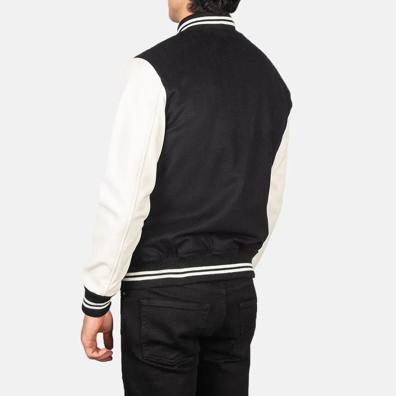 This black and white varsity jacket, crafted from a combination of cotton and wool, offers a fashionable outerwear option.