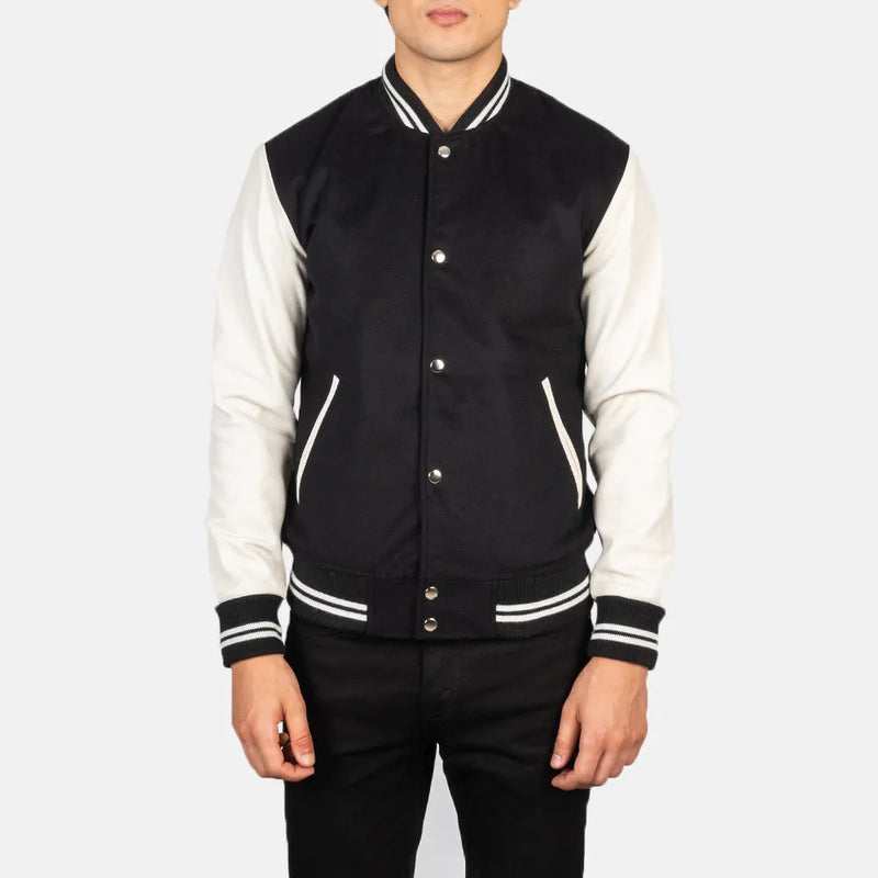 This black and white varsity jacket, crafted from a combination of cotton and wool, offers a fashionable outerwear option.