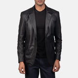  An edgy man rocking a black blazer jacket men's, adding a touch of rebellion to his look.