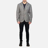 A dapper gentleman in a gray blazer leather jacket, showcasing a sleek and modern style.