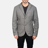 A dapper gentleman in a gray blazer leather jacket, showcasing a sleek and modern style.