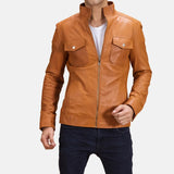 A stylish man wearing a brown men's leather jacket, exuding confidence and a touch of ruggedness.