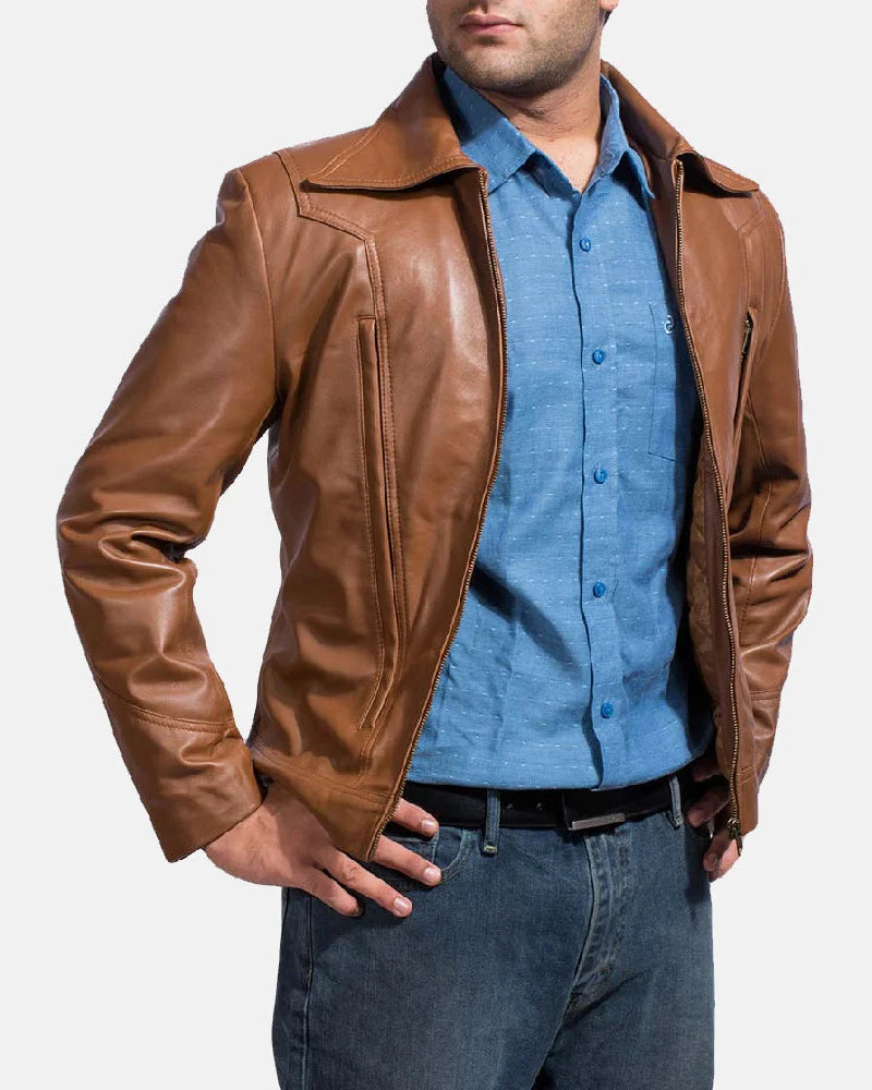 A suave man donning a brown leather shirt jacket, epitomizing timeless coolness and making a bold fashion statement.