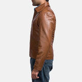 A suave man donning a brown leather shirt jacket, epitomizing timeless coolness and making a bold fashion statement.