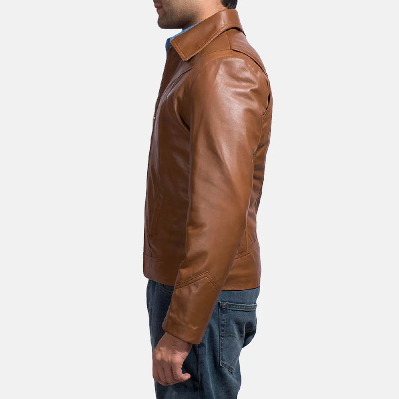 A suave man donning a brown leather shirt jacket, epitomizing timeless coolness and making a bold fashion statement.