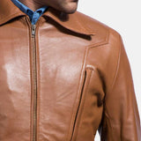 A suave man donning a brown leather shirt jacket, epitomizing timeless coolness and making a bold fashion statement.