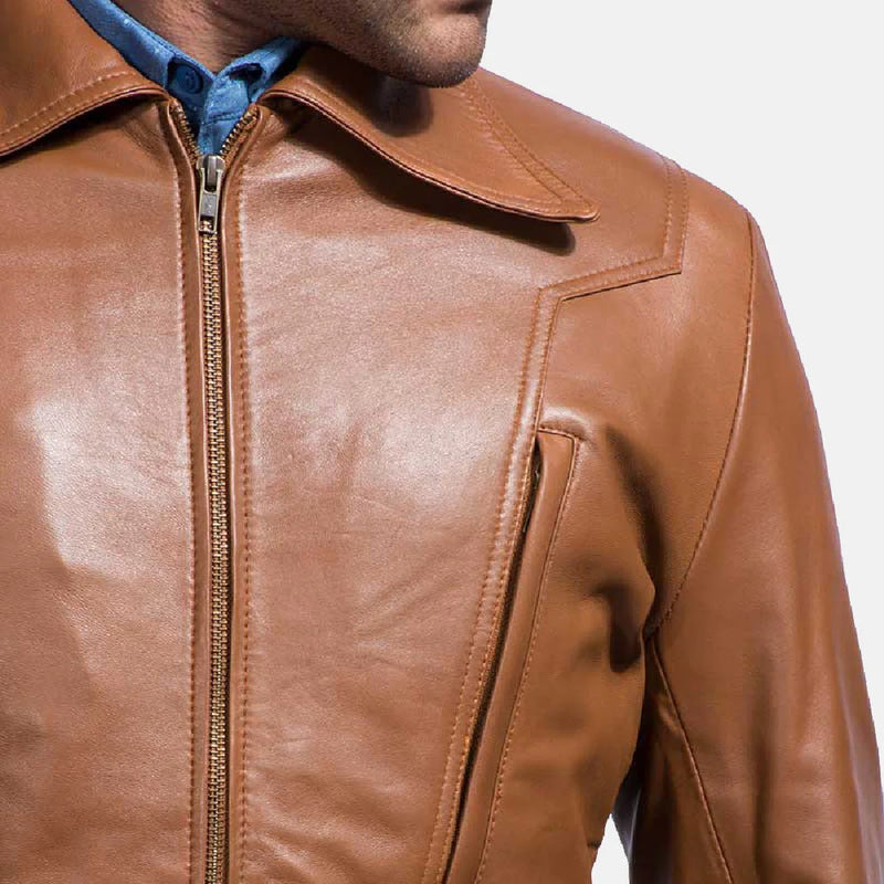 A suave man donning a brown leather shirt jacket, epitomizing timeless coolness and making a bold fashion statement.