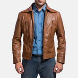 A suave man donning a brown leather shirt jacket, epitomizing timeless coolness and making a bold fashion statement.