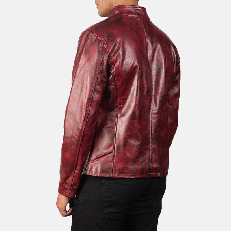 A stylish burgundy leather jacket, crafted from cowhide leather, adds a touch of sophistication to any outfit.