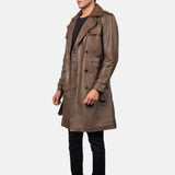 A stylish man wearing a distressed brown leather coat, exuding an air of mystery and sophistication.