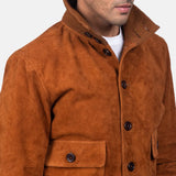 A lavish brown suede bomber jacket, exquisitely crafted from goatskin leather, exudes opulence and sophistication.