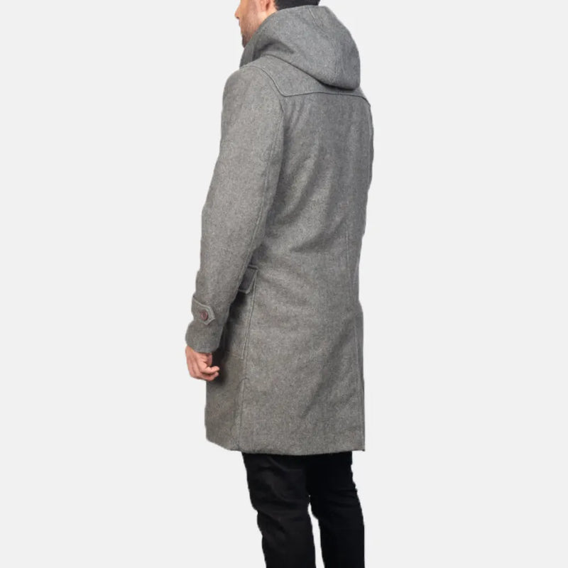 A fashionable man in a grey leather coat.