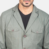 A man in a grey jacket stands up, wearing a stylish grey leather jacket men.