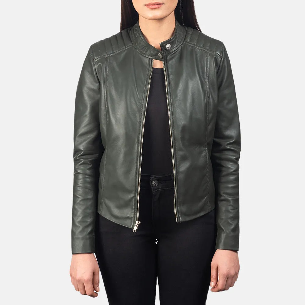 Ladies green biker jacket made of leather, featuring a front zipper for a fashionable and edgy appearance.