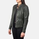 Ladies green biker jacket made of leather, featuring a front zipper for a fashionable and edgy appearance.