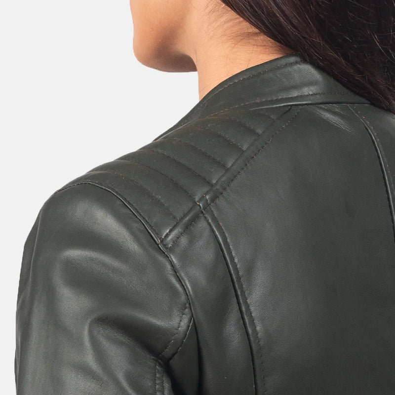 Ladies green biker jacket made of leather, featuring a front zipper for a fashionable and edgy appearance.