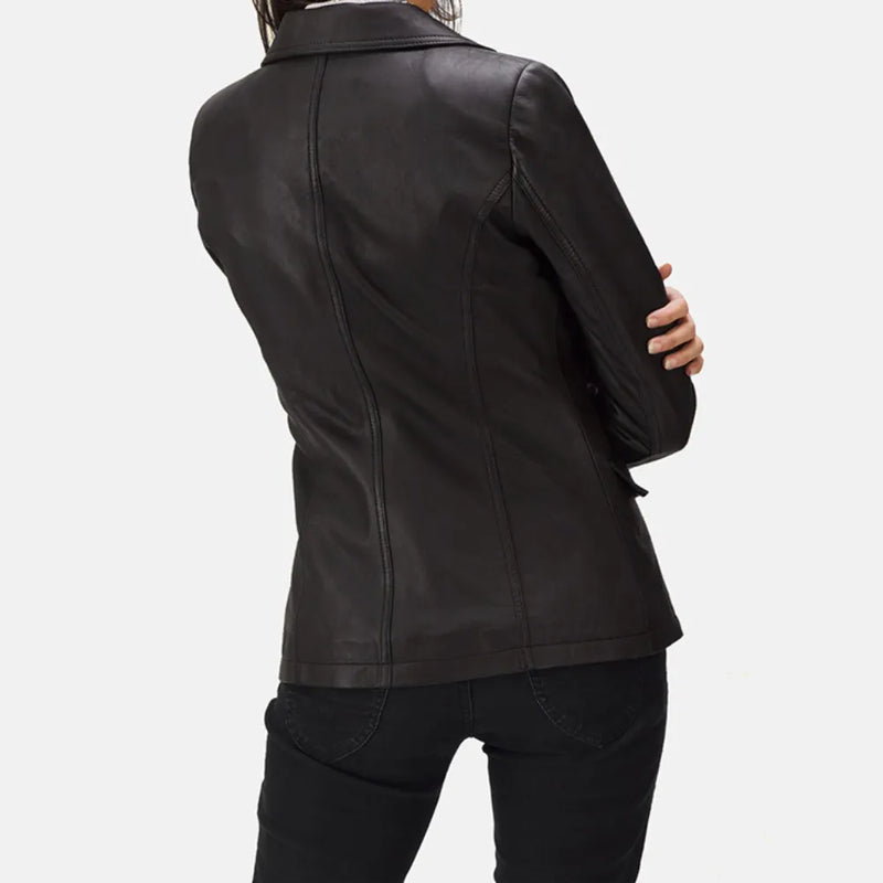 A fashionable black leather blazer women, epitomizing edgy chic with her trendy attire.
