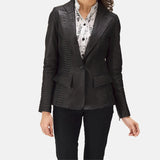 A fashionable black leather blazer women, epitomizing edgy chic with her trendy attire.