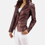 A woman in a burgundy leather jacket, showcasing the latest collection of Leather Blazers for Women.