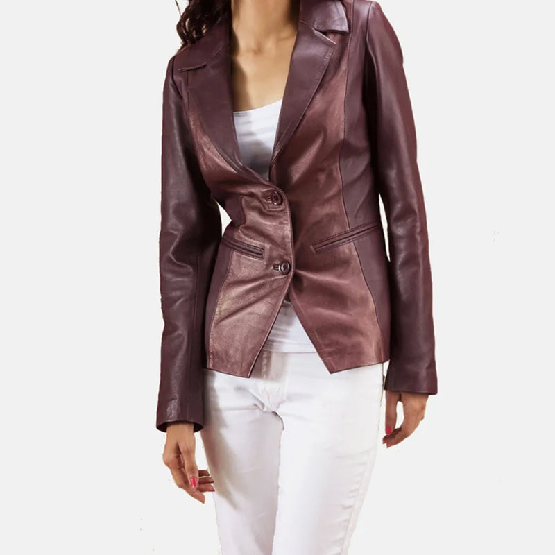 A woman in a burgundy leather jacket, showcasing the latest collection of Leather Blazers for Women.