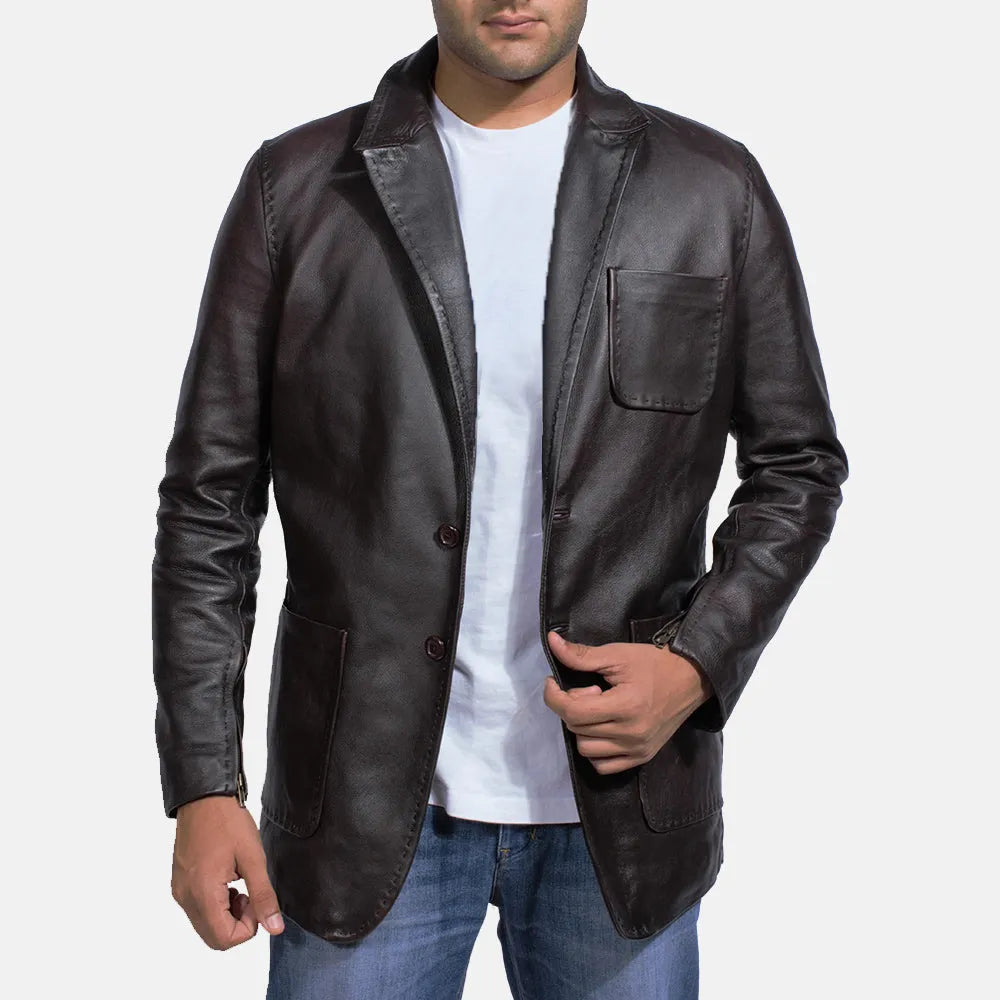 A man wearing a black leather jacket, also known as a Leather Jacket Blazer Men's.