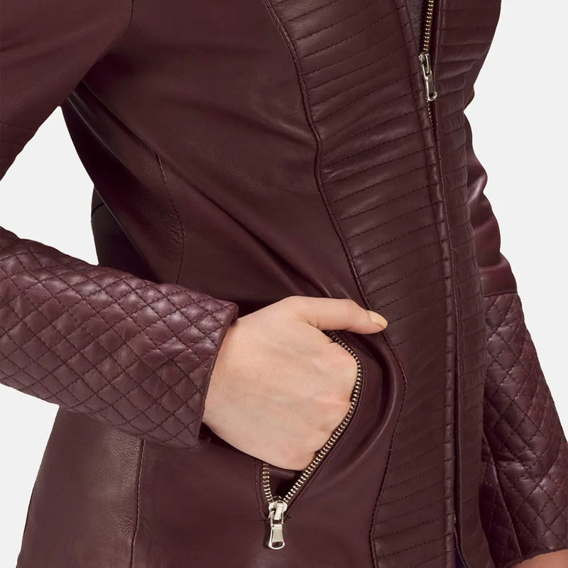 A stylish woman rocking a leather jacket maroon, exuding confidence and adding a touch of elegance to her ensemble.