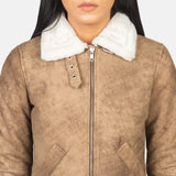 A cool leather jacket with fur brown collar for women. It looks stylish and warm!