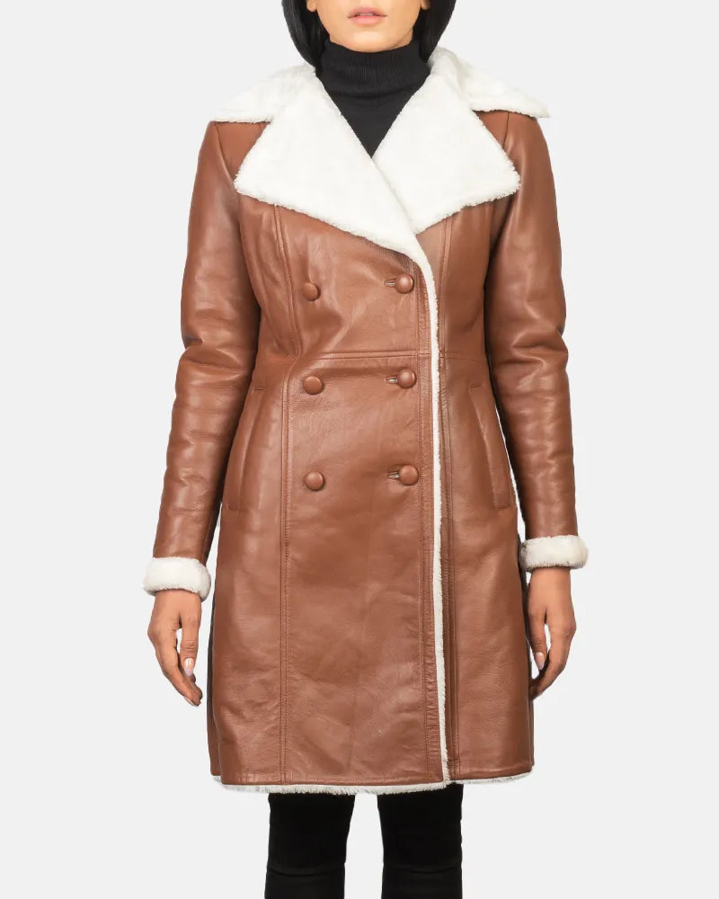 A stylish women's leather trench coat made from brown and white shearling. Stay warm and fashionable!