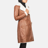 A stylish women's leather trench coat made from brown and white shearling. Stay warm and fashionable!