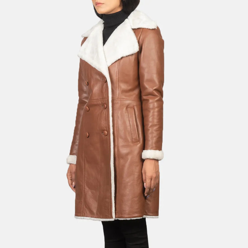 A stylish women's leather trench coat made from brown and white shearling. Stay warm and fashionable!