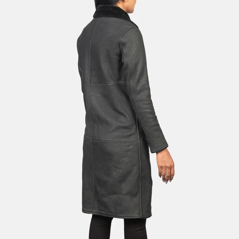 A long black trench coat made from sheepskin, providing a stylish and warm outerwear option.