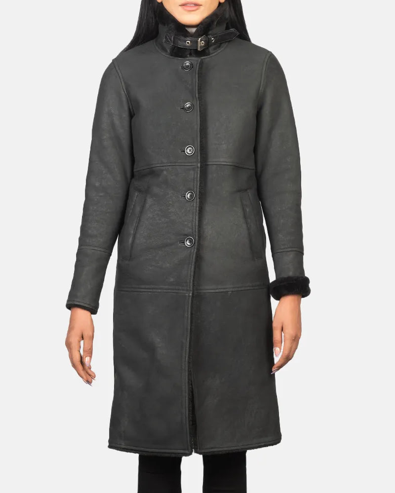 A long black trench coat made from sheepskin, providing a stylish and warm outerwear option.