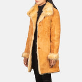 An elegant donning a long female trench coat in tan, complete with a luxurious fur collar for added style and comfort.