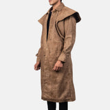 Stylish man in long leather brown coat exudes sophistication and elegance.