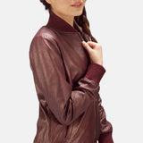The fashionable maroon leather jacket ladies, exuding confidence and a touch of edginess.