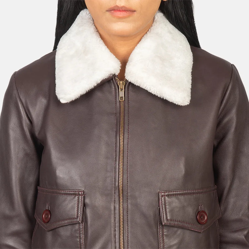A stylish maroon leather jacket women with a collar and cuffs, perfect for adding a touch of elegance to any outfit.