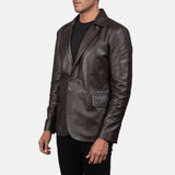 A fashion-forward man embraces his coolness in a men's brown leather blazer jacket.